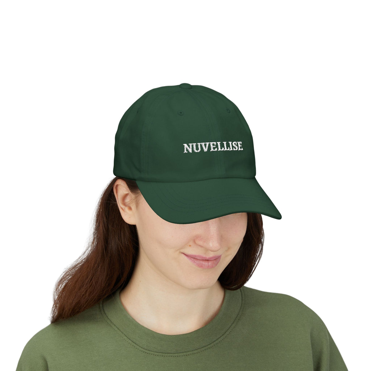 Dark green NUVELLISE Signature Cap with white embroidery on a model